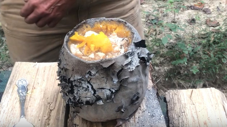 Stuffed pumpkin cooked in firepit