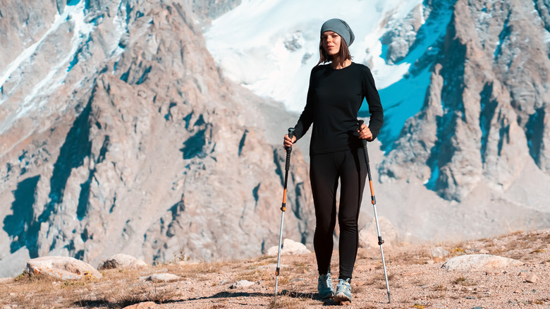 Young female hiker wearing thermal base layers 