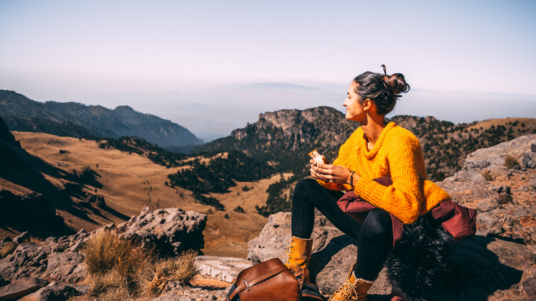 Woman eating lunch on a hike