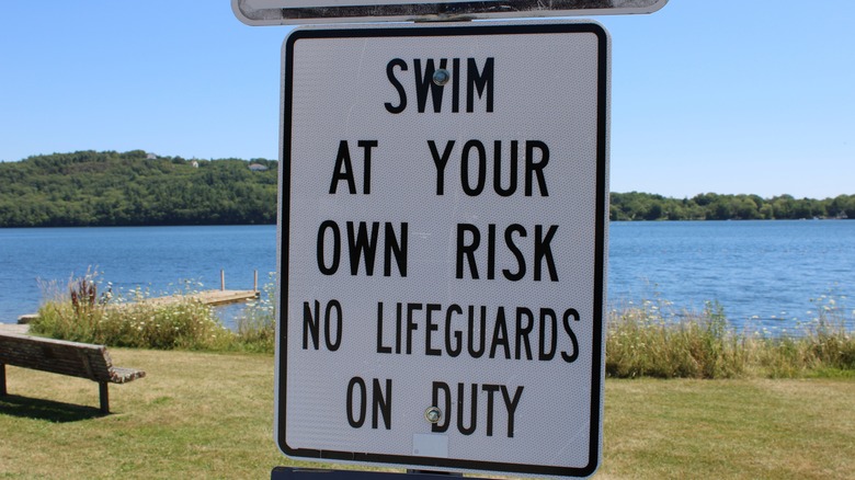 Swim at your own risk sign
