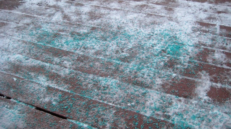 Ice melt on a wood deck melting snow and ice from the boards