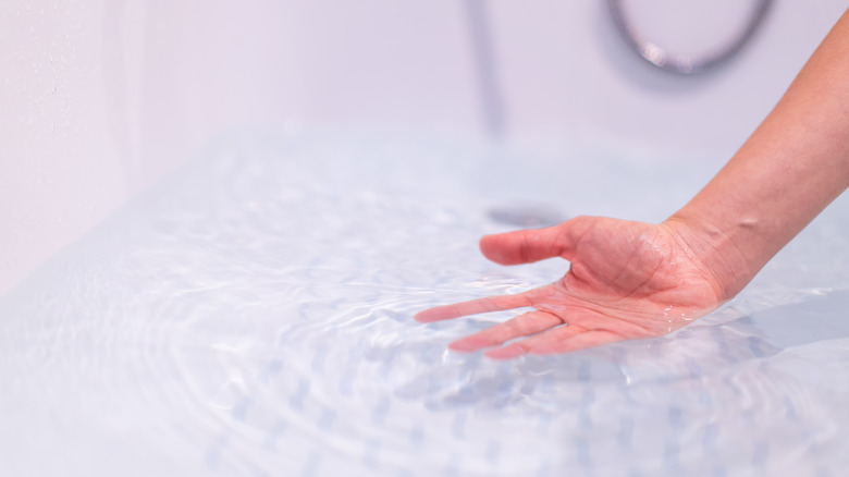 Hand in warm bath 