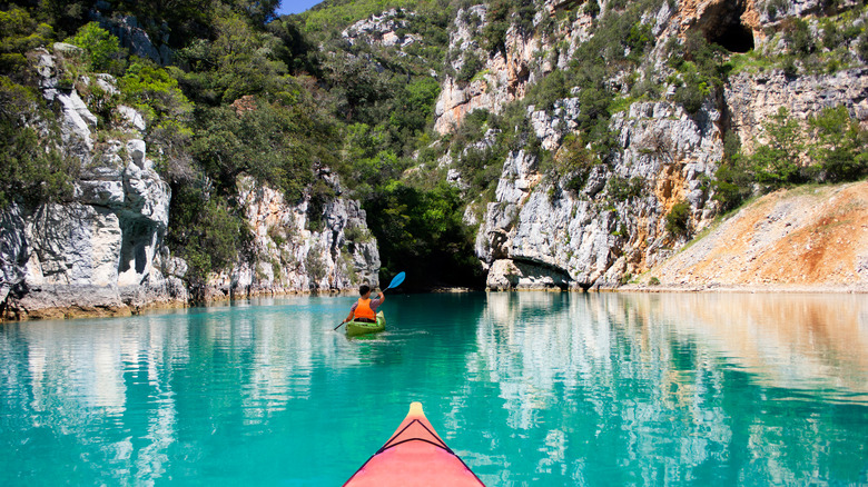 Kayaker heading into cave