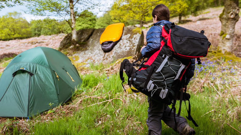 backpacker carrying gear