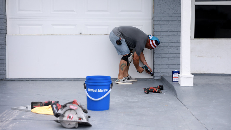 Man sealing garage