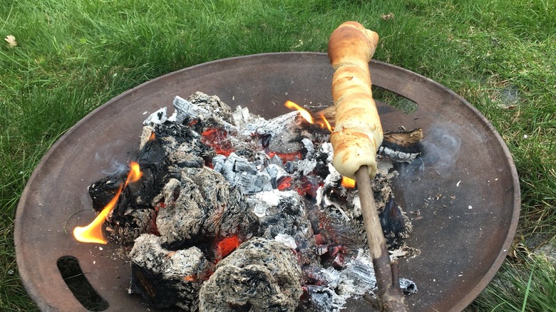 German stick bread cooked over fire