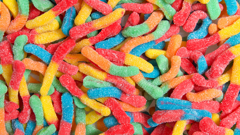 Pile of bright, sour gummy worms 