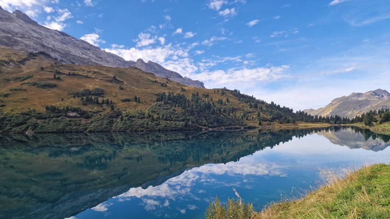 Via Alpina hike, landscape of lake and hills