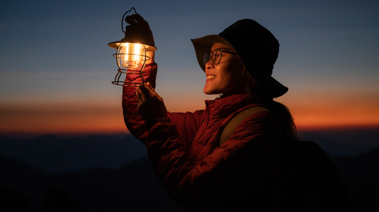 Woman holding lantern