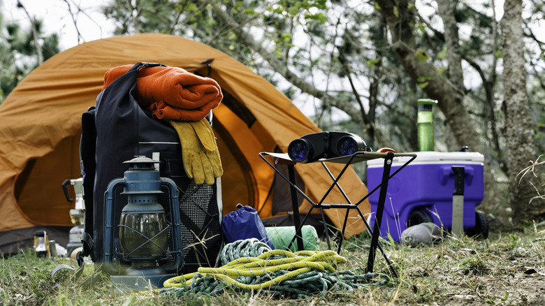 A campsite with camp gear set up and displayed in the front