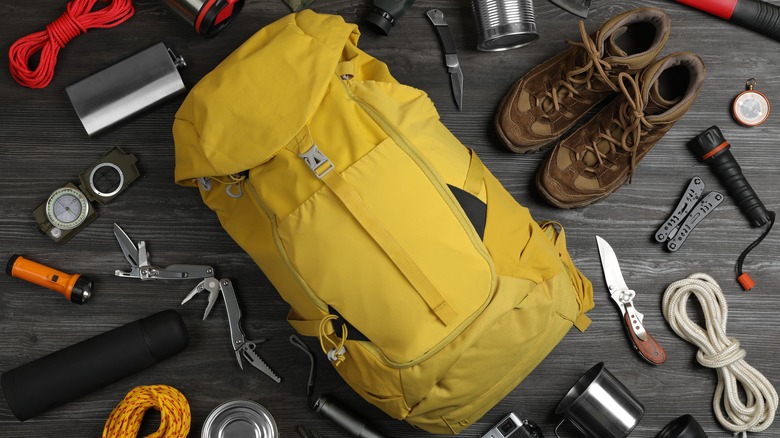 Hiking gear sprawled around backpack