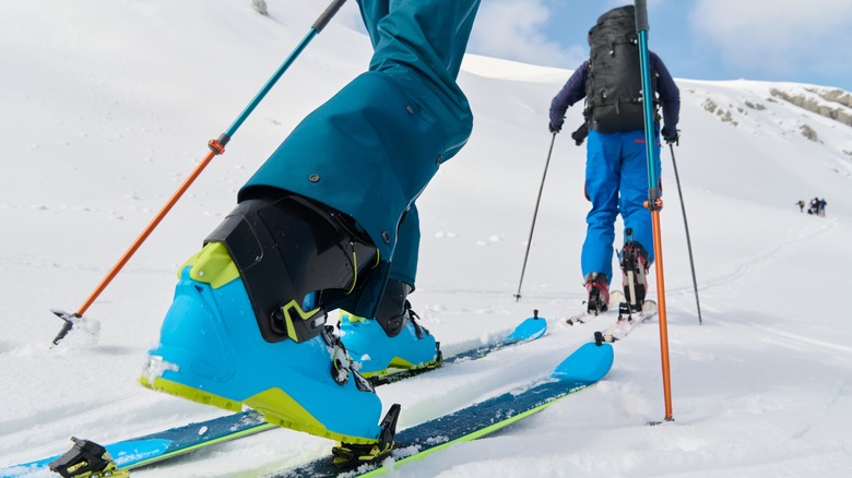 Closeup of skier following another skier