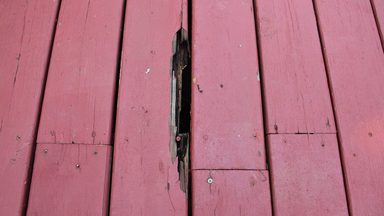 Broken board on porch