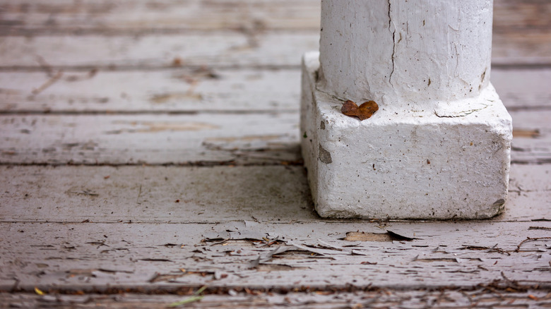 peeling paint on a wood porch