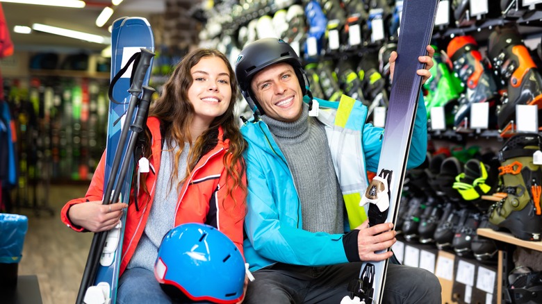 Man and woman buying ski gear