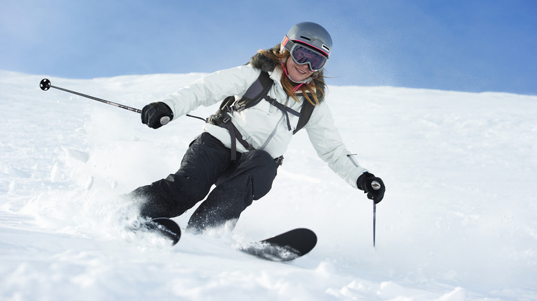 Woman downhill skiing