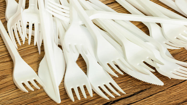 Pile of plastic forks and knives