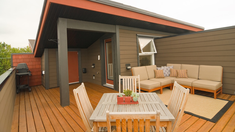 deck with a table and chairs on it