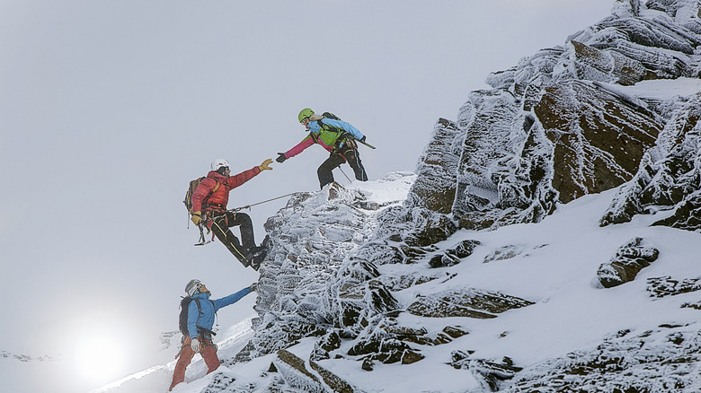 Group of mountain climbers scaling a mountain