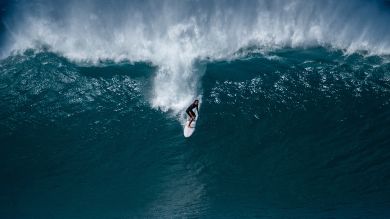 Surfer on gigantic wave in Banzai Pipeline 