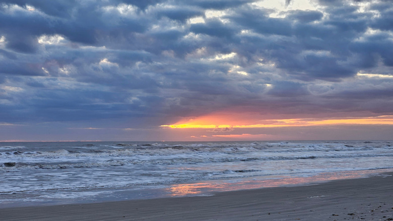 View of water at New Smyrna Beach, Florida at dusk