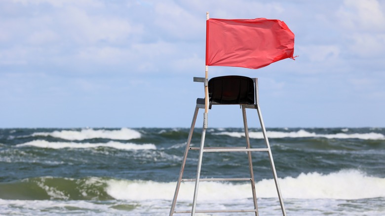Red flag on lifeguard chair