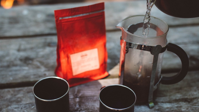 Camping French press and two coffee mugs