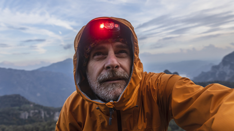 Hiker with red headlamp