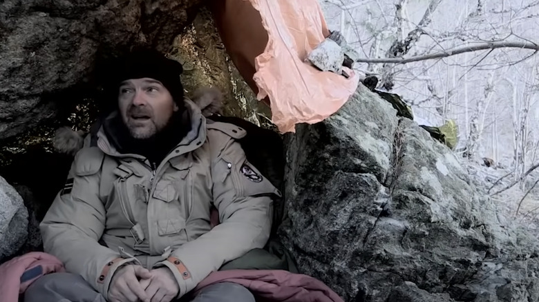 Les Stroud in a rock shelter in Norway