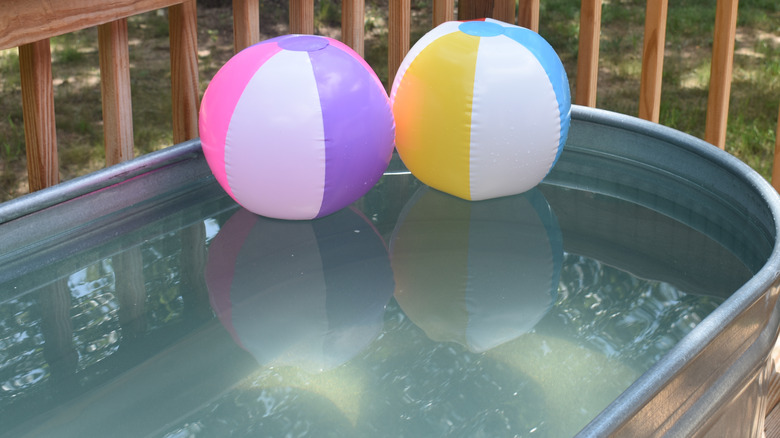 Beach balls in stock tank pool