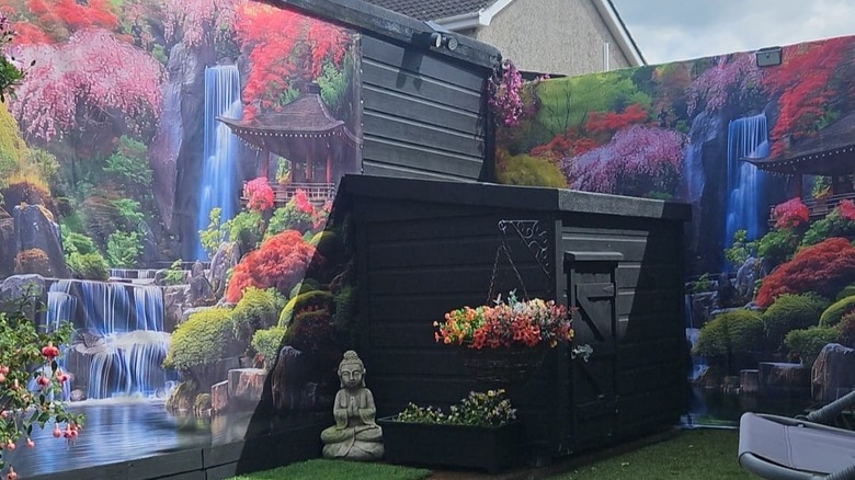 Shower curtains hanging on fence