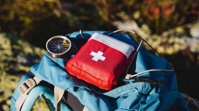 Backpack with first-aid kit and compass