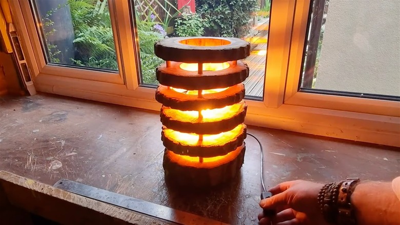 DIY cracked log garden lamp with spiral slits