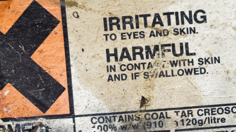 Warning sign for irritating compound