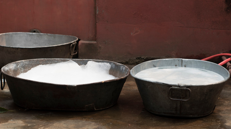 Tubs of soapy water