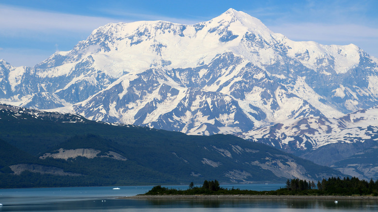 Mount St. Elias standing behind lake view