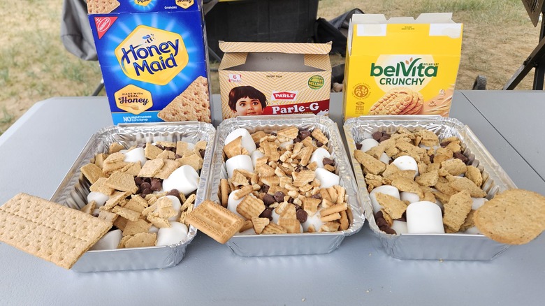 Prepping s'mores bake with three different cookies