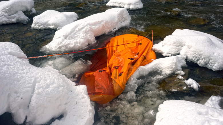 Tent drowned in snowy river