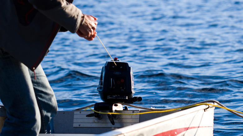Pull starting boat motor