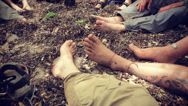 Feet of many people in a circle