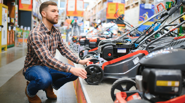 Man shopping for lawn mower